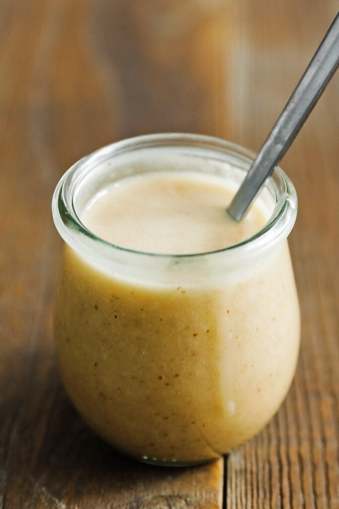 jar of mustard vinaigrette with a spoon