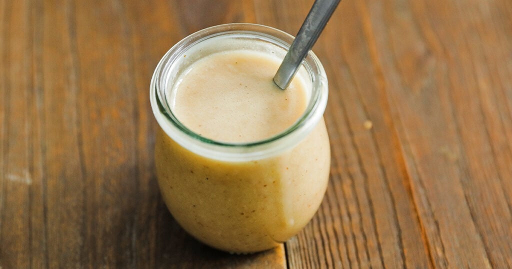 jar of mustard vinaigrette with a spoon