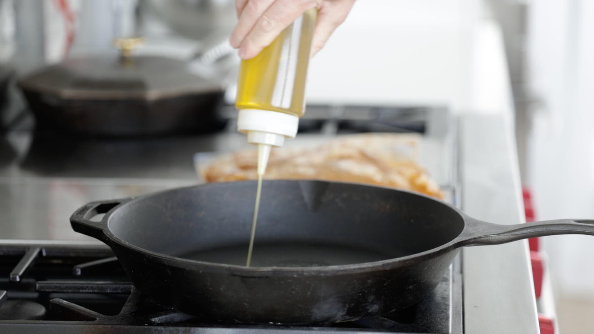 adding oil to a pan