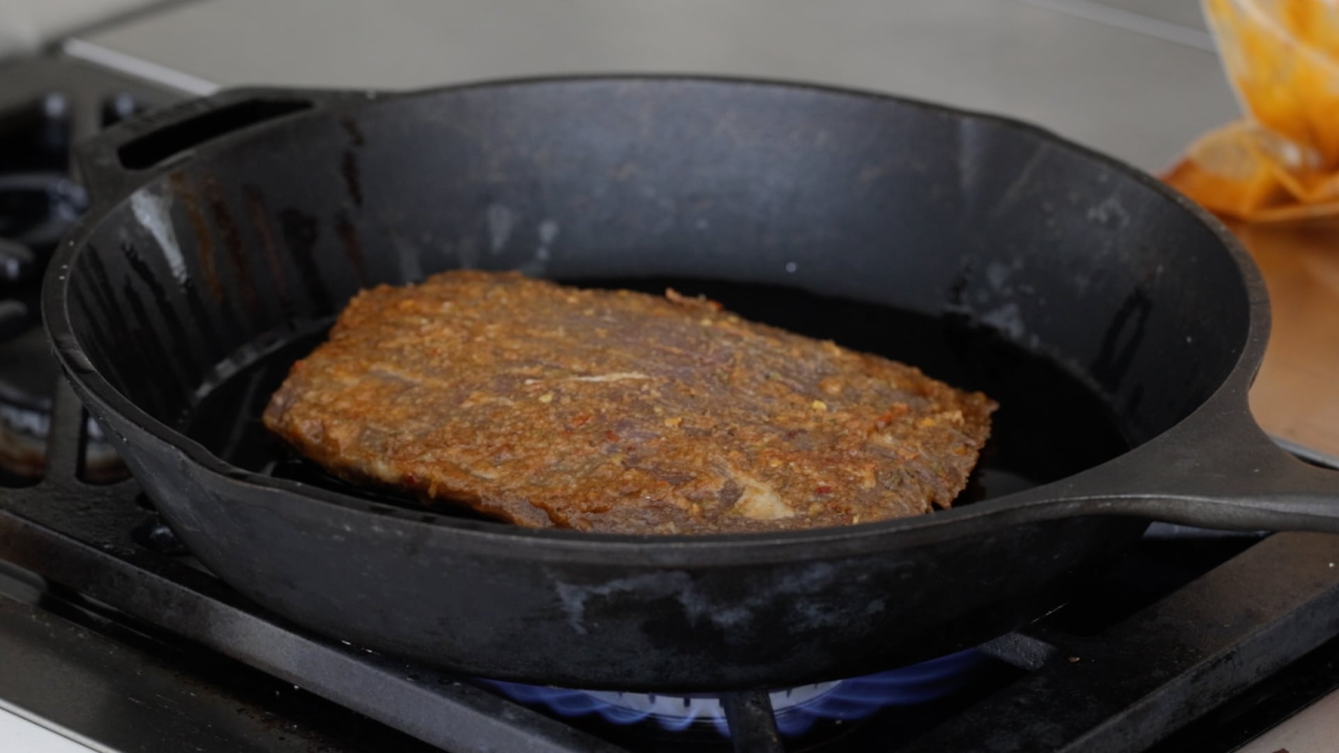 searing a steak in a pan