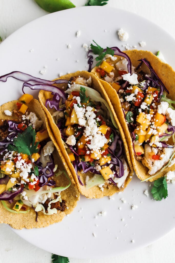 fish tacos loaded with cheese and mango sauce