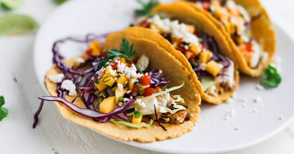 plating a fish taco with salsa