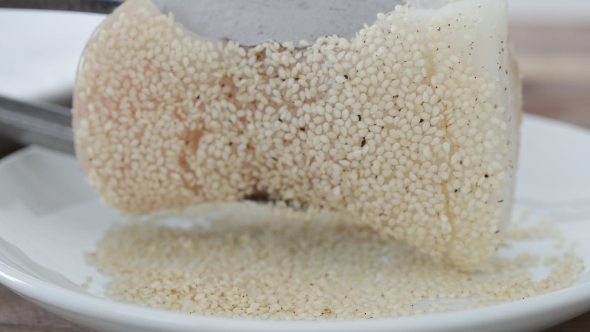 encrusting halibut in sesame seeds