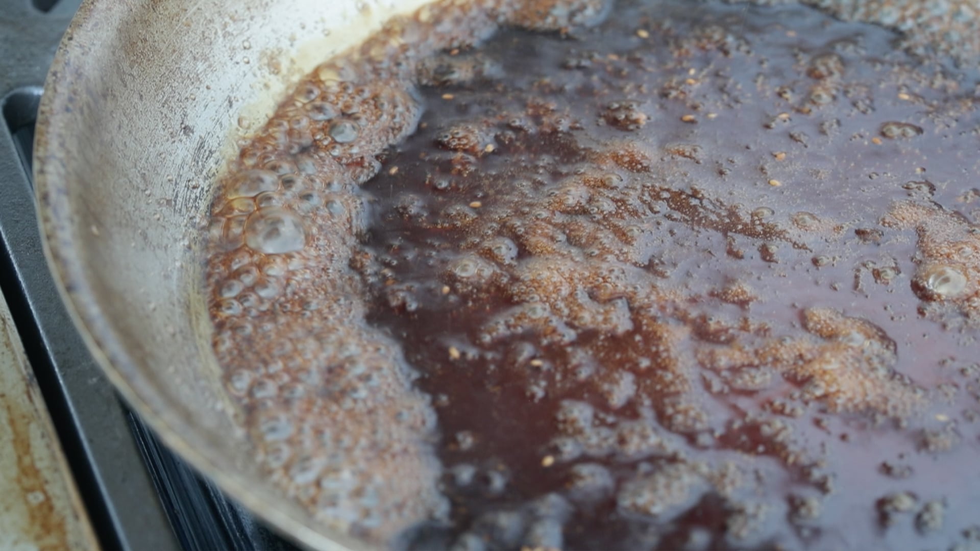cooking a soy glaze in a pan