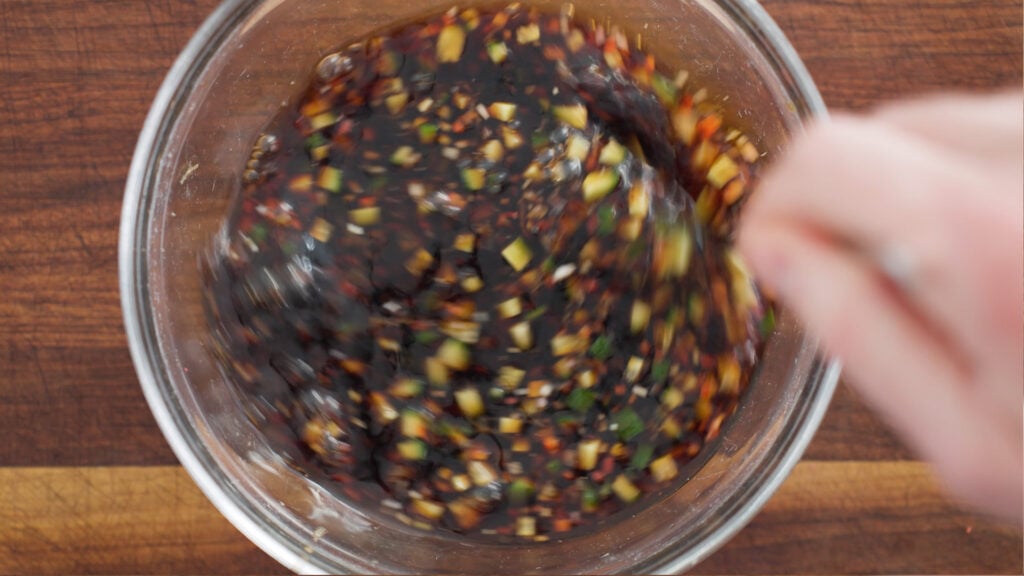 Ingredients in bowl being stirred together