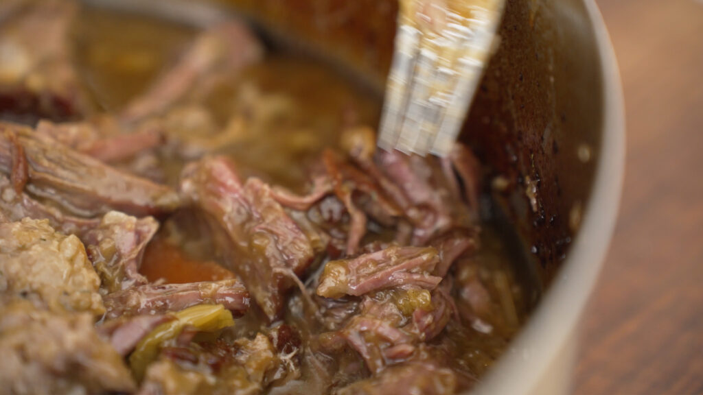 Close up of cooked roast in the rondeau pot
