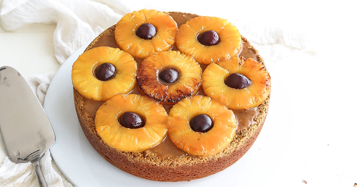 adding cherries to a pineapple upside down cake