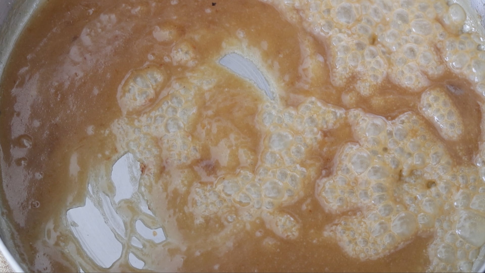 whisking caramel