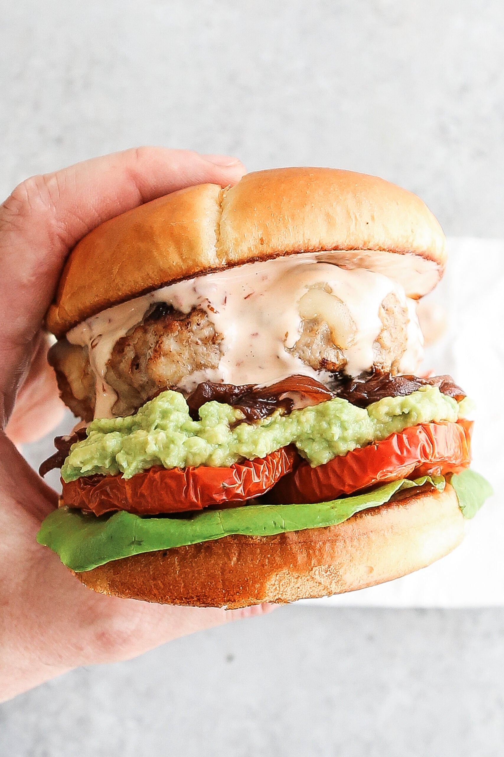 turkey burger with avocado and tomato