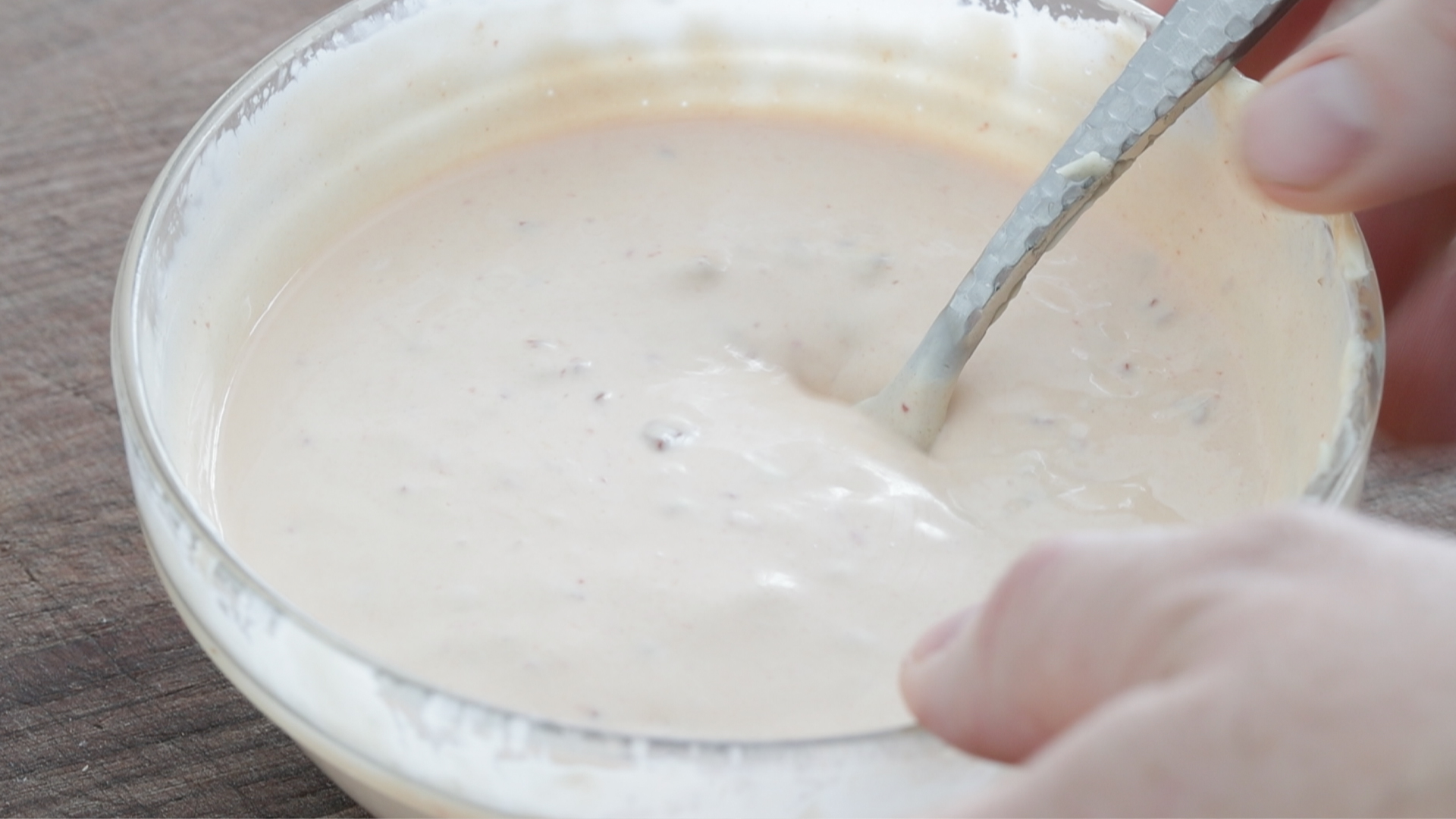 whisking together chipotles and mayonnaise
