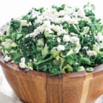 a large wooden bowl filled with maroulosalata