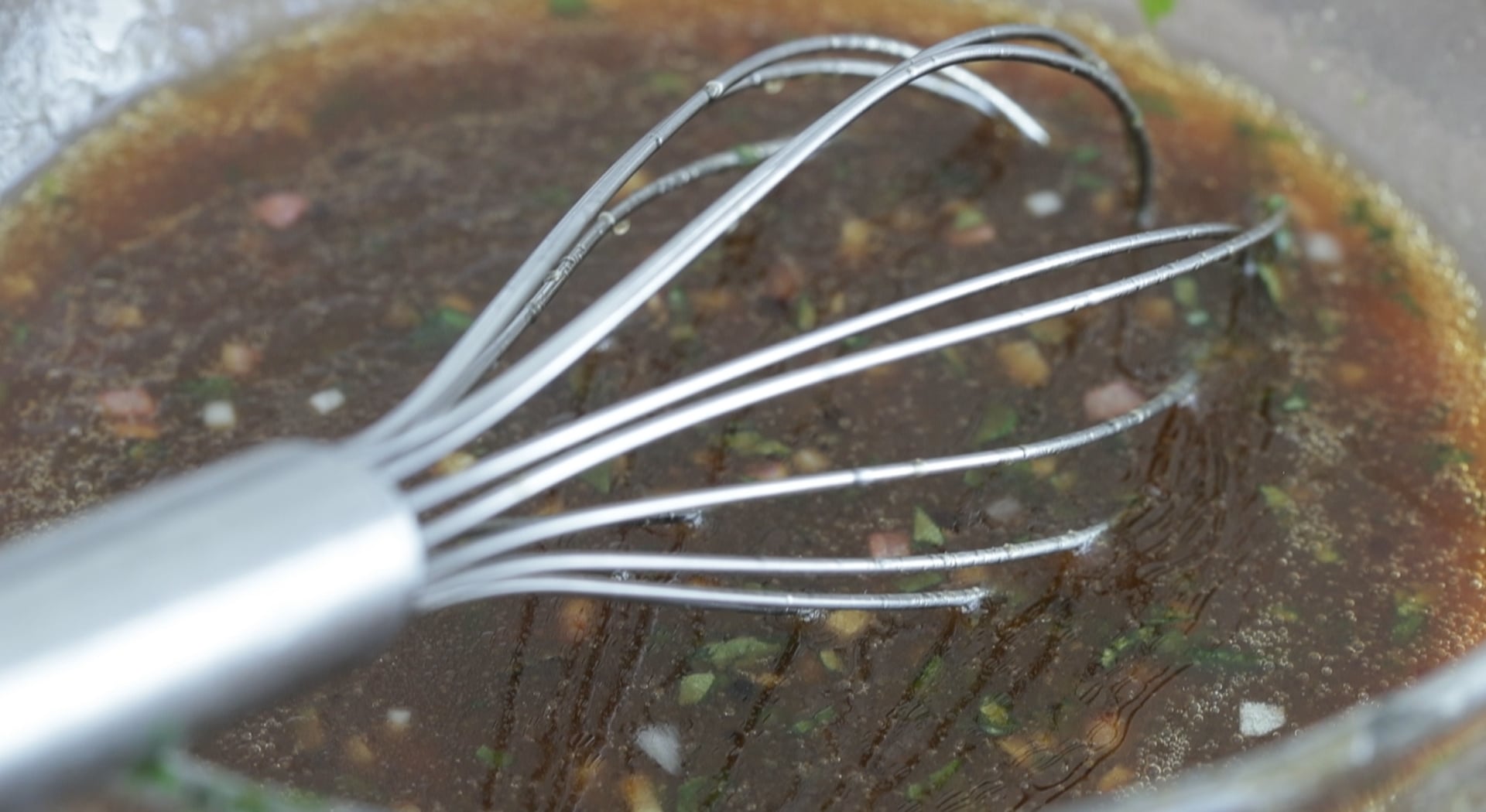 whisking a balsamic vinaigrette