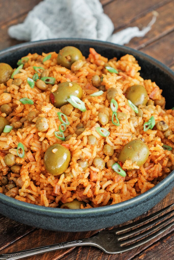 Arroz con gandules in a black serving bowl