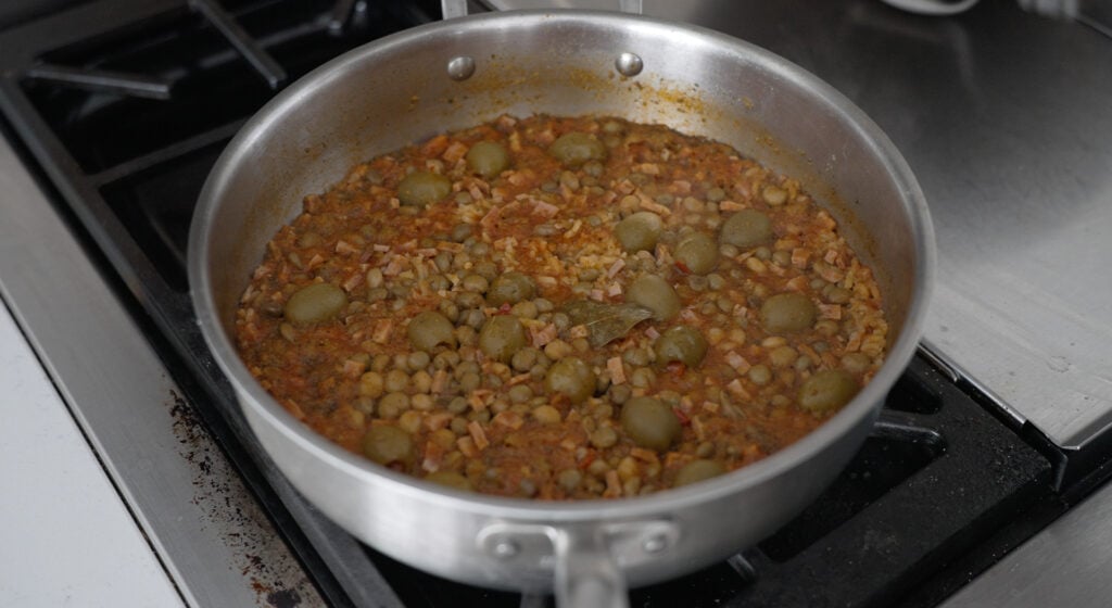 Arroz con gandules, mid cook in a large stainless steel pan