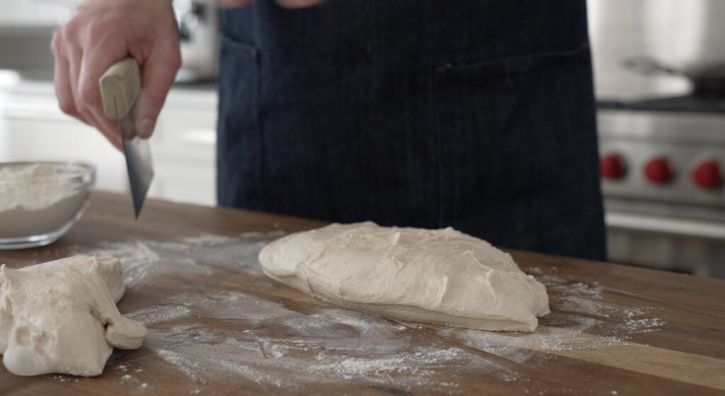 Dividing dough on a floured surface