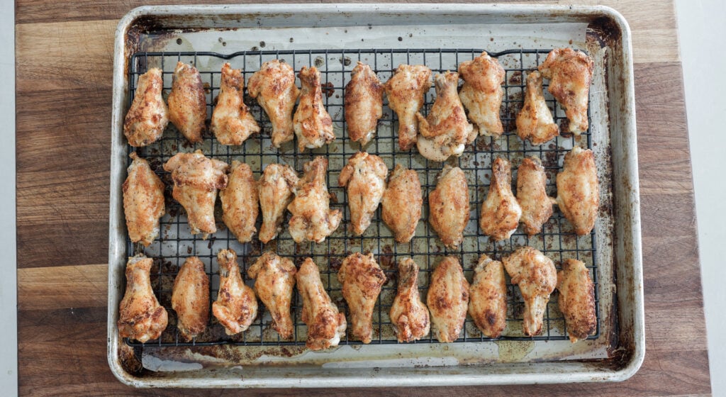 browned, cooked wings on a rack
