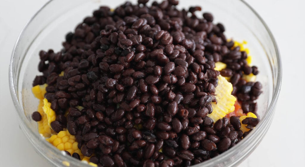 combining all salsa ingredients in a bowl