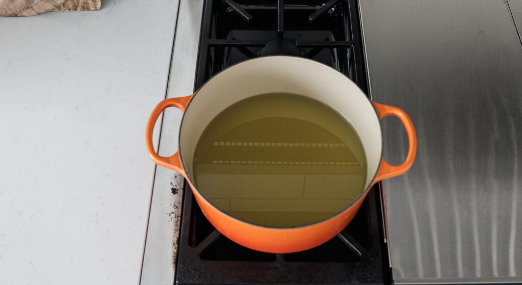 a pot filled with oil on a stove