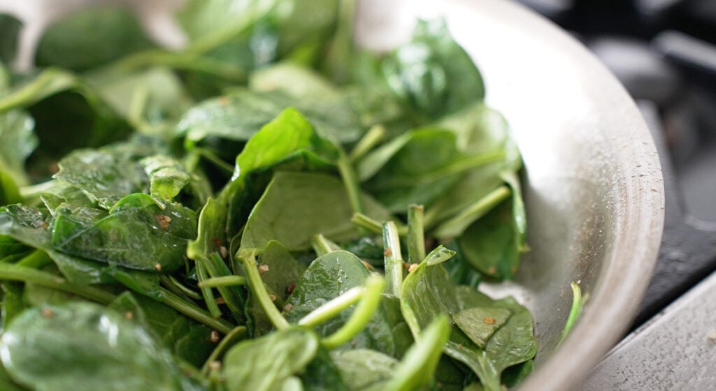 close up of bright green spinach not yet wilted