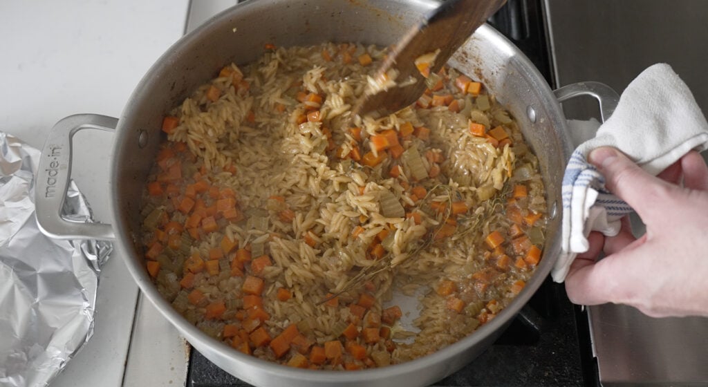 orzo  and carrots in a rondeau pot