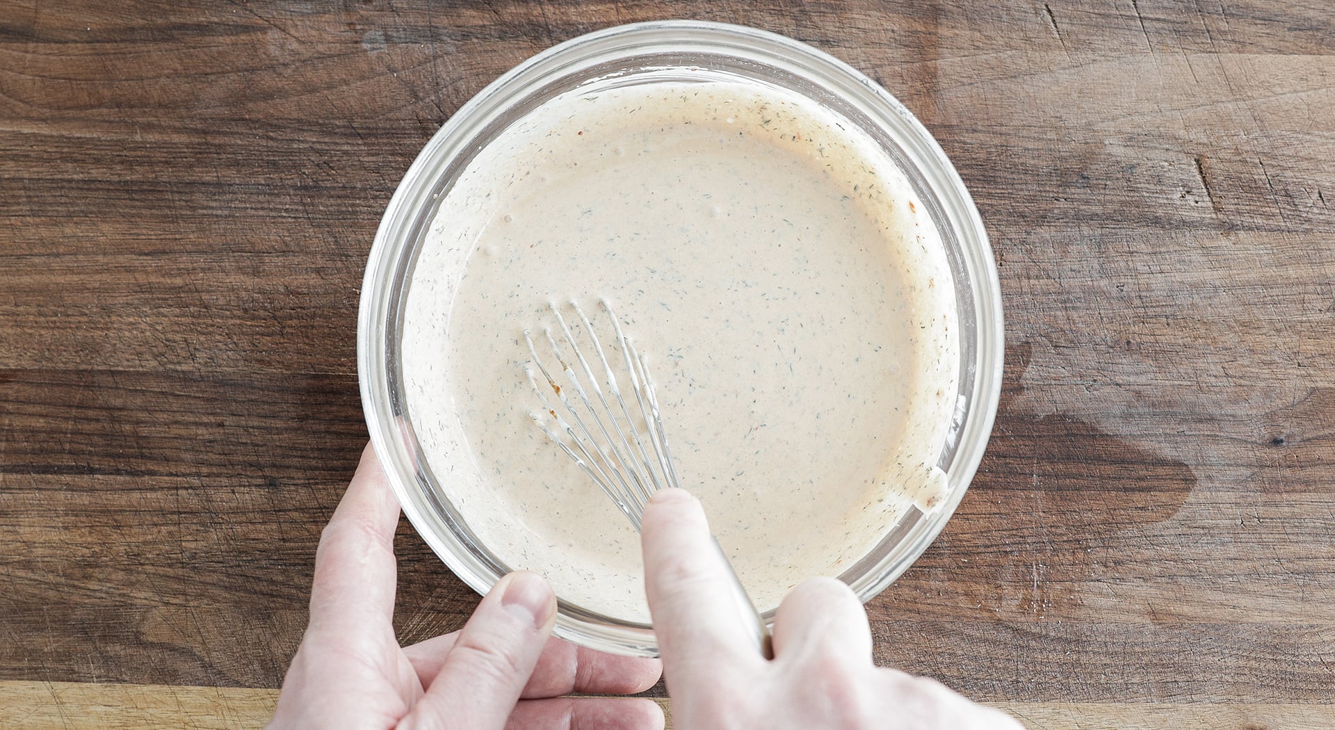 whisking a chipotle ranch in a bowl