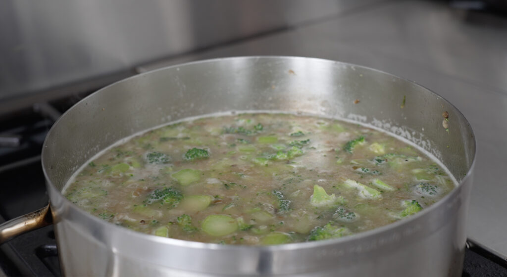 pot of soup with broth added