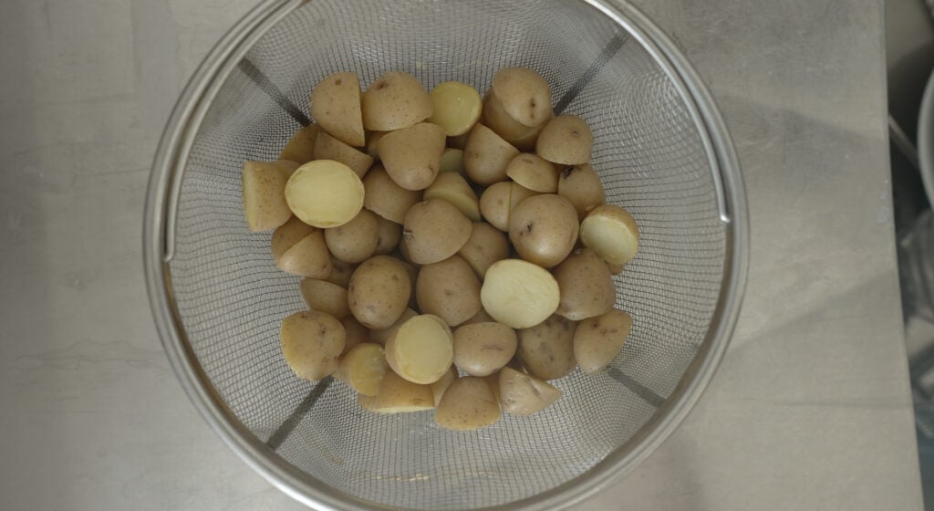 top down view of potatoes in a strainer