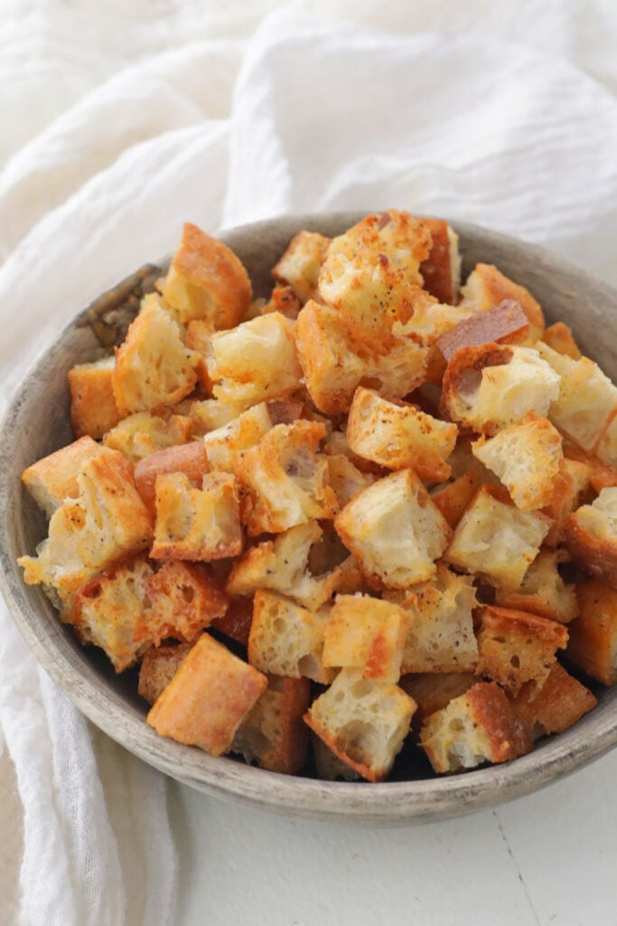 a bowl of browned bread croutons