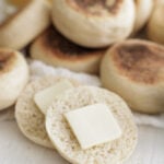 English muffin sliced in half with butter