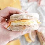 Holding an english muffin sandwich