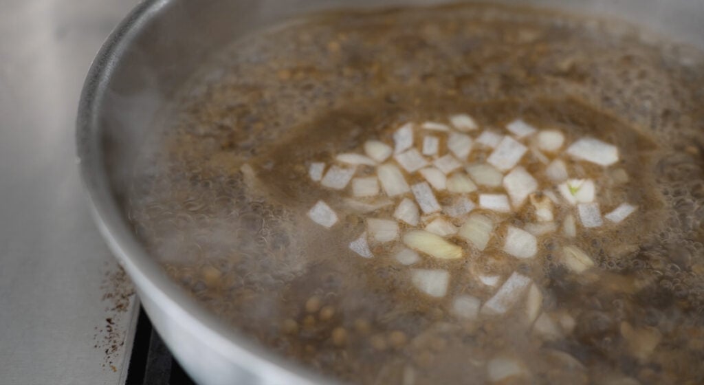Steamy pot of lentils cooking