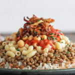 Side view of koshari on a plate