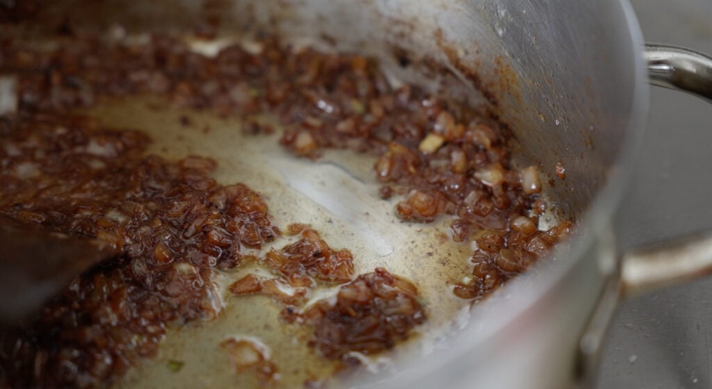 caramelized, very brown small onion pieces in a pot