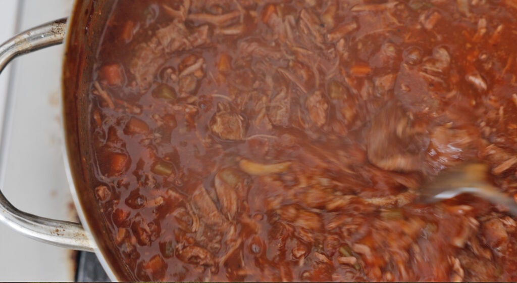 shredded lamb meat in a dark red brown sauce