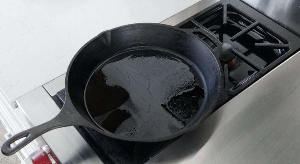 Oil heating in a cast iron skillet