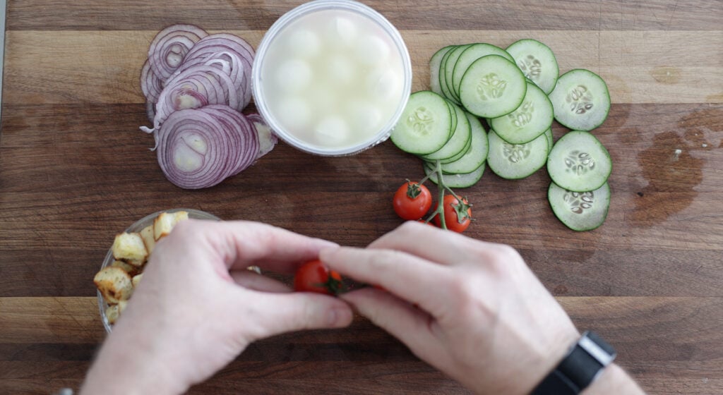overhead view of sliced veggies on a cutting board