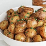Mustard potatoes in a white serving bowl