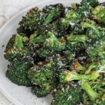 Roasted broccoli on a white plate
