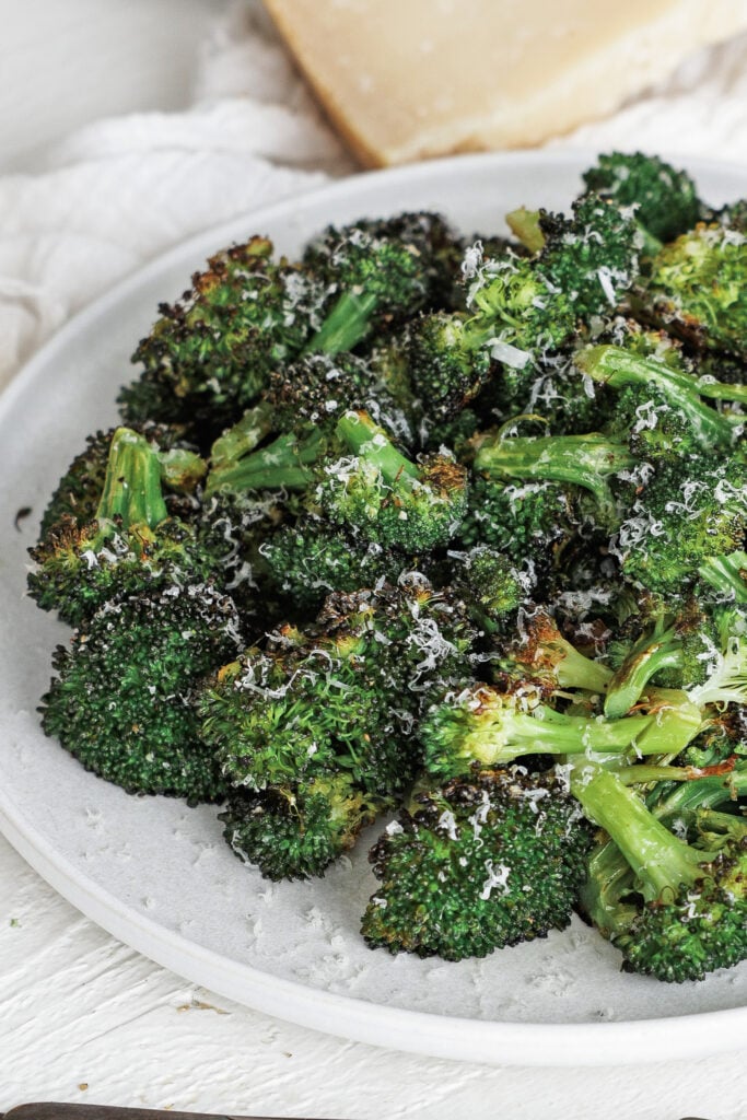 Roasted broccoli on a white plate