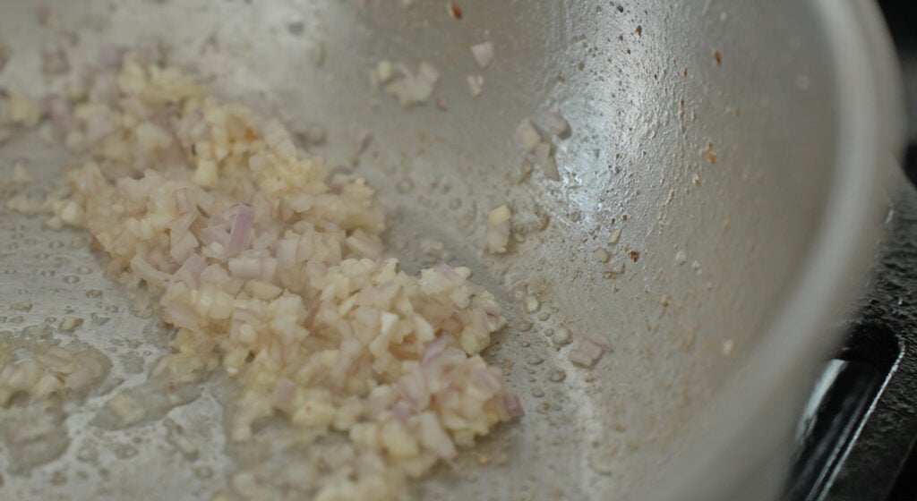 shallots and garlic in a pan