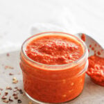 Shatta sauce in a small, round glass jar