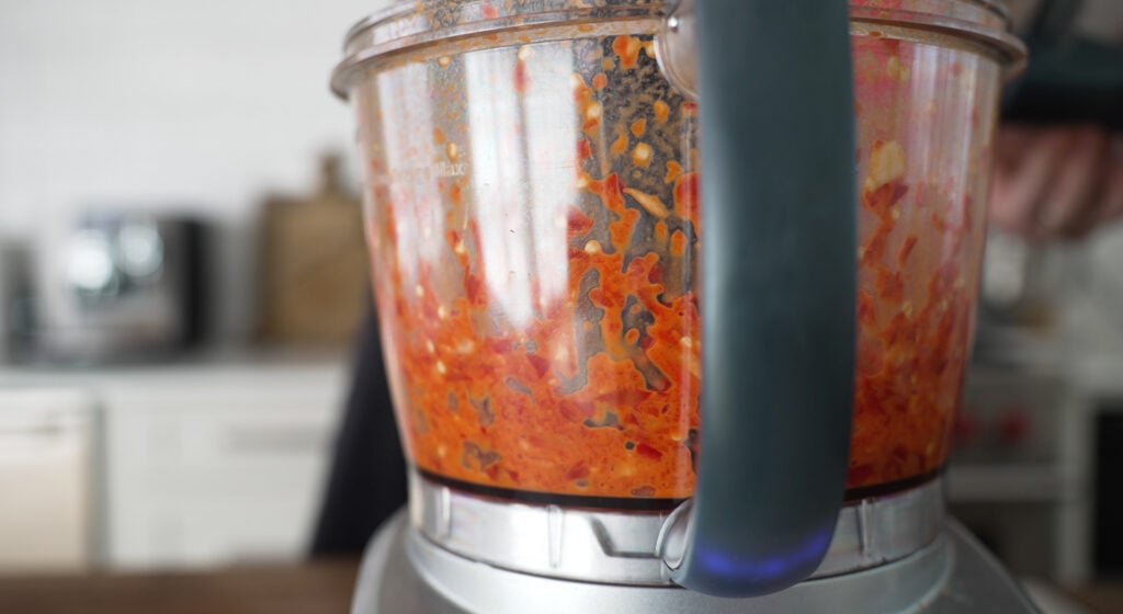 side view of food processer with ingredients blended