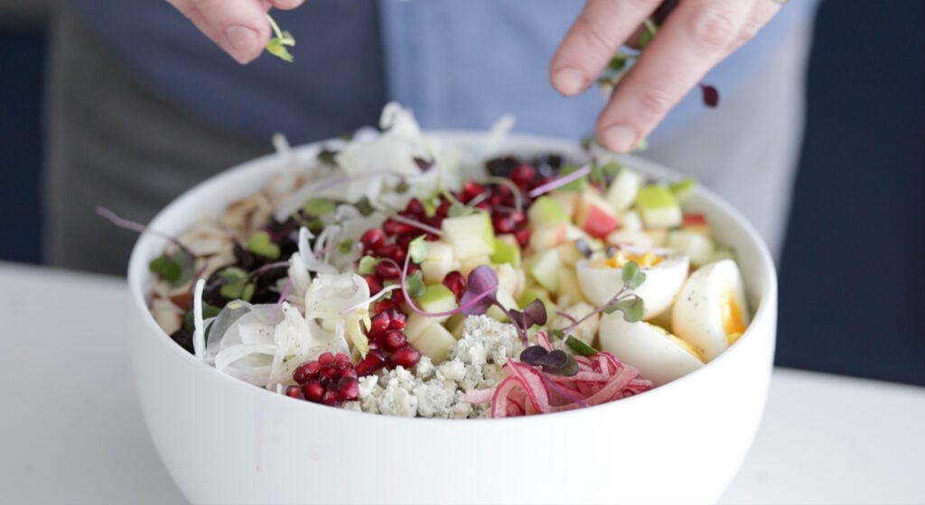 assembling the salad on a bowl