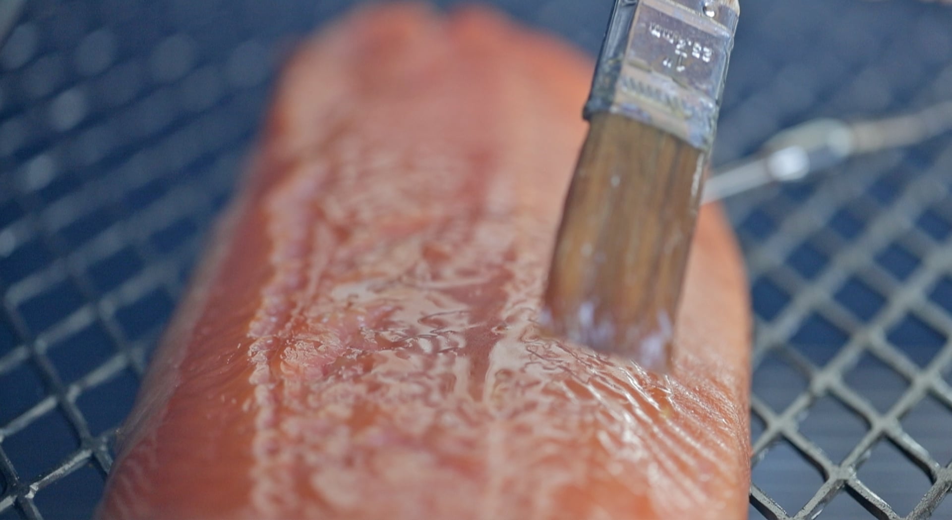 brushing a salmon with a glaze