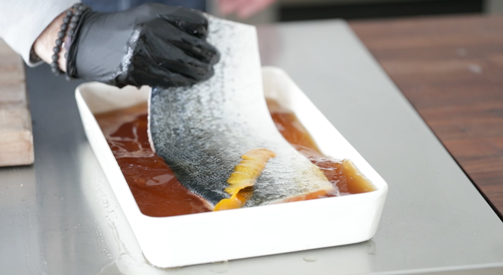flipping a salmon over in brine