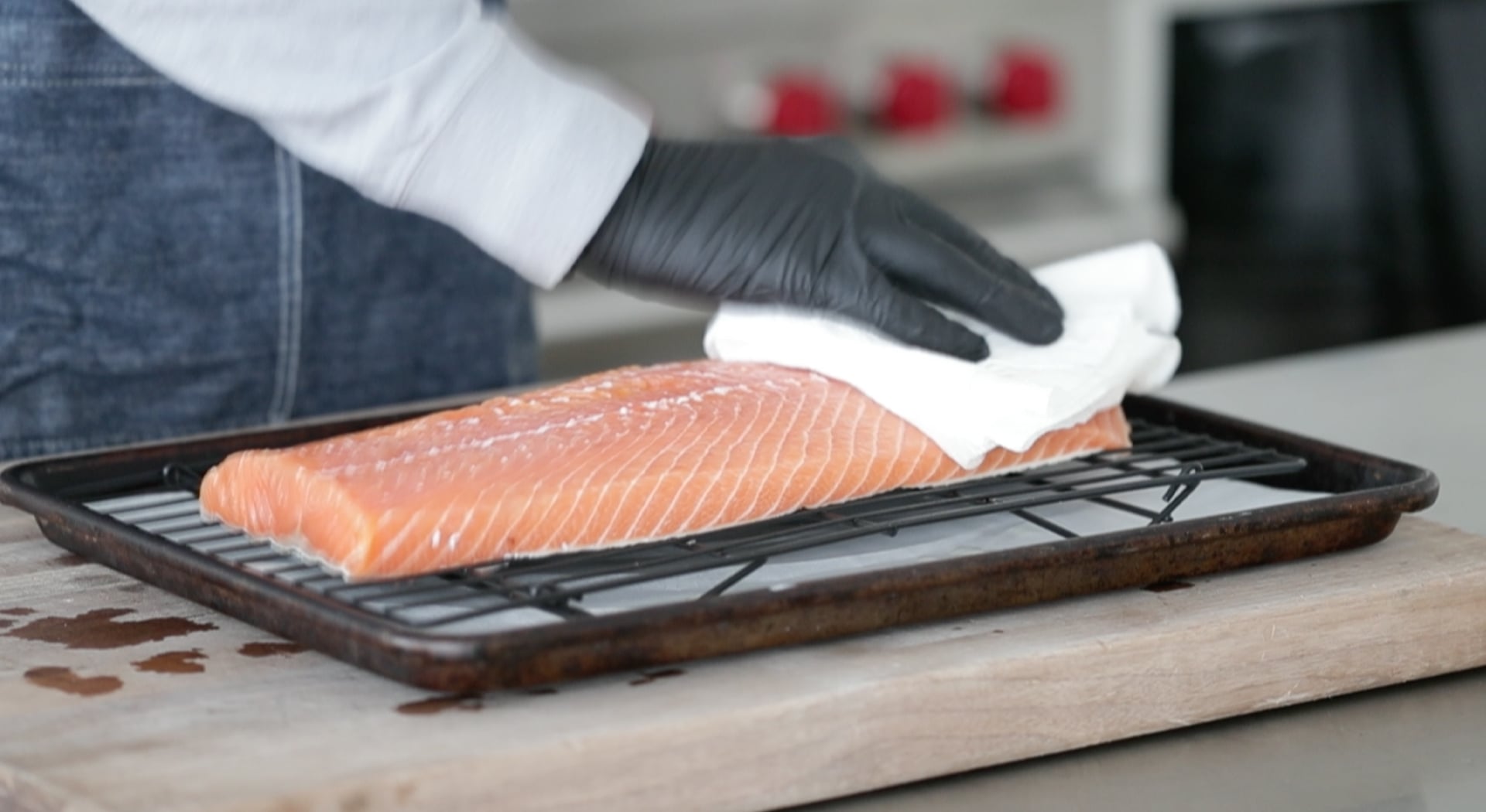 patting dry a side of salmon