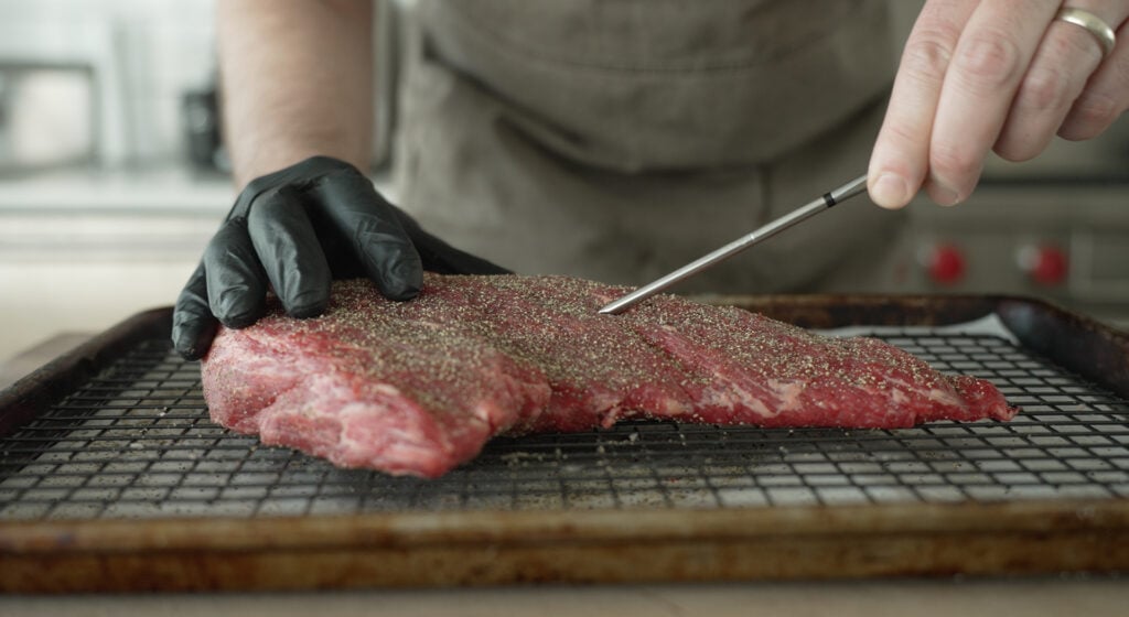 placing a thermometer into the tri tip