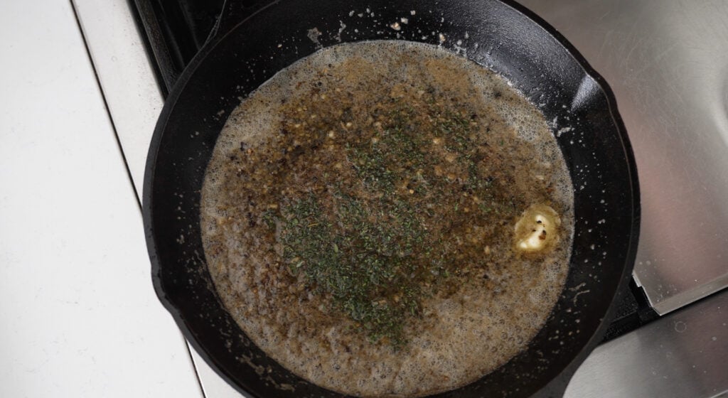 Butter melting in the pan with the browned shallot-garlic mixture