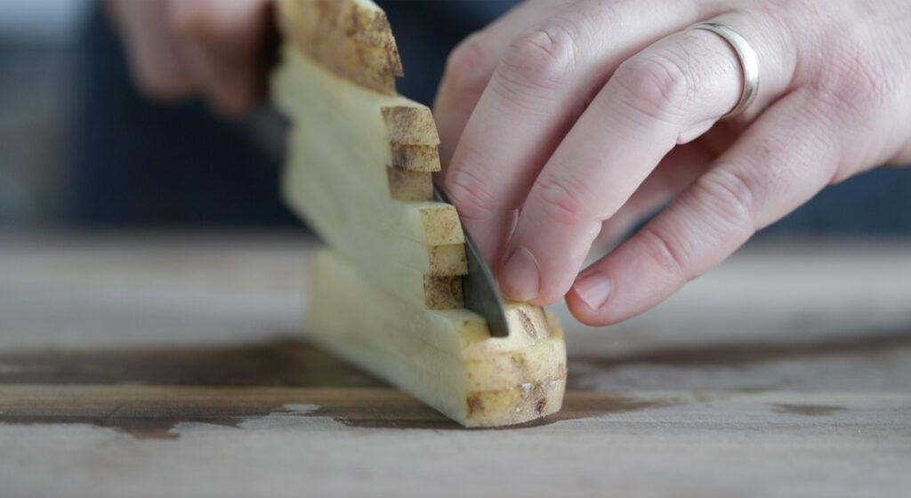 cutting the potatoes
