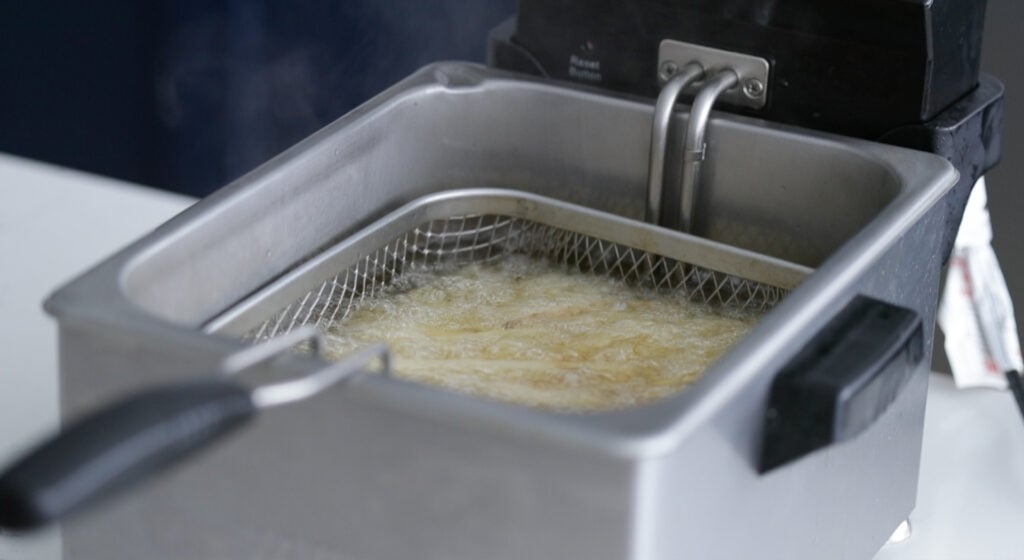 blanching the fries in fryer